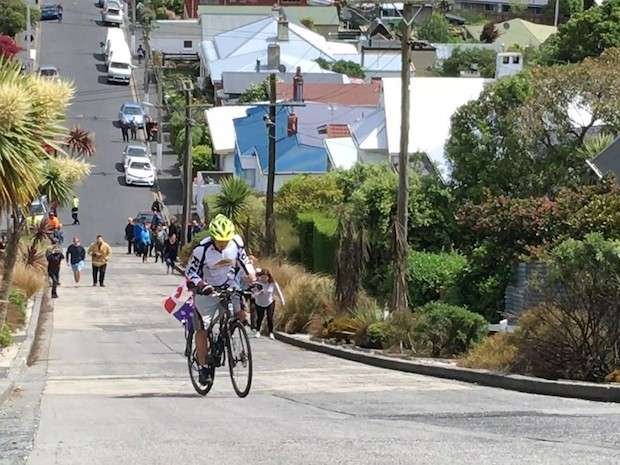 Cycling climbing world's steepest street
