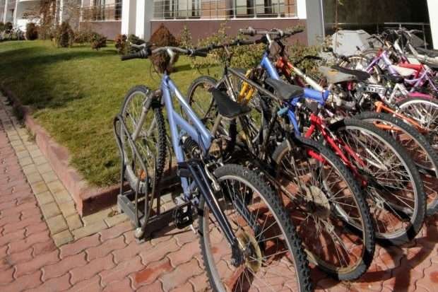 14 Easy Ways on How To Store a Bike in Small Apartments Bikes stored outside an apartment building after owners learned how to store a bike in an apartment