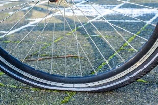 Flat bicycle tire as a sign for when to replace bike tires