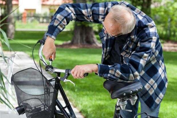 10 Bicycle Seats That Protect the Perineum Old man adjusting bike handlebar after buying bicycle seat that protects the perineum